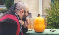 Rev. DeLuxe blesses the pumpkin